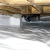Bare floor joists in a sealed, insulated crawl space in Langford.