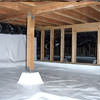 A large, encapsulated crawl space with our vapor barrier system installed in Courtenay.