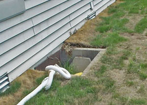 old concrete window well of a Victoria crawl space