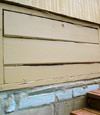 an old-fashioned crawl space door in Qualicum Beach about to be replaced