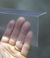 Closeup of a clear plastic covering on a Central Saanich crawl space block wall