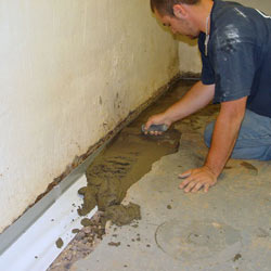 Testing a French drain system in a Central Saanich home.