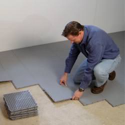 basement subfloor tiles being installed by a contractor in Gibsons