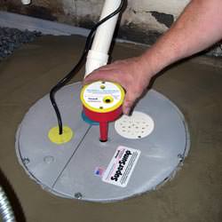 A newly installed sump pump system in a basement in Nanoose Bay
