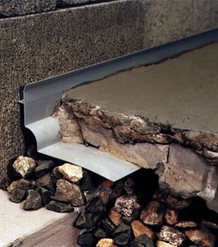 a custom designed basement drain system for thin basement floors in Whistler.