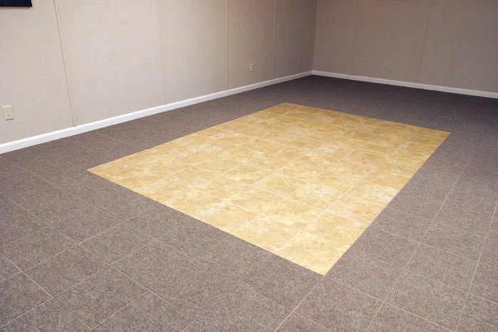 tiled and carpeted basement flooring installed in a Duncan home