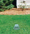 A buried gutter drain downspout extension installed in a Black Creek home