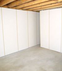 Unfinished basement insulated wall covering in Esquimalt, British Columbia