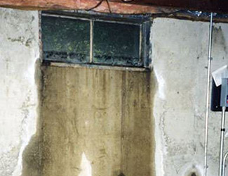 Water pouring out from a basement window in Campbell River